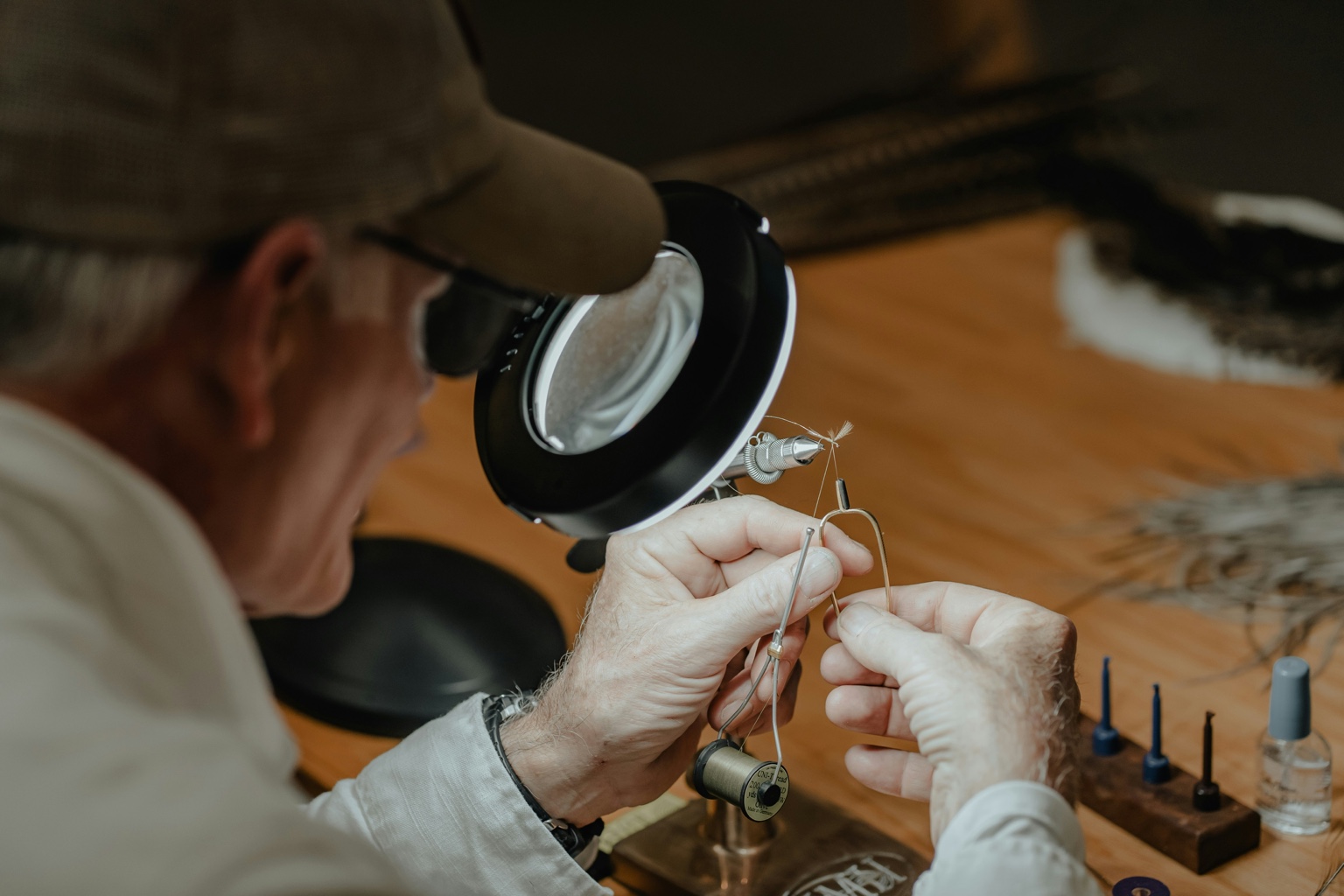 Older man tying fly - craftsmanship